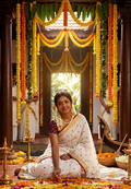 White and wine linen saree with thread embroidery and gold zari border