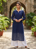 navy blue embroidered chikankari kurta with white wide-leg pants.