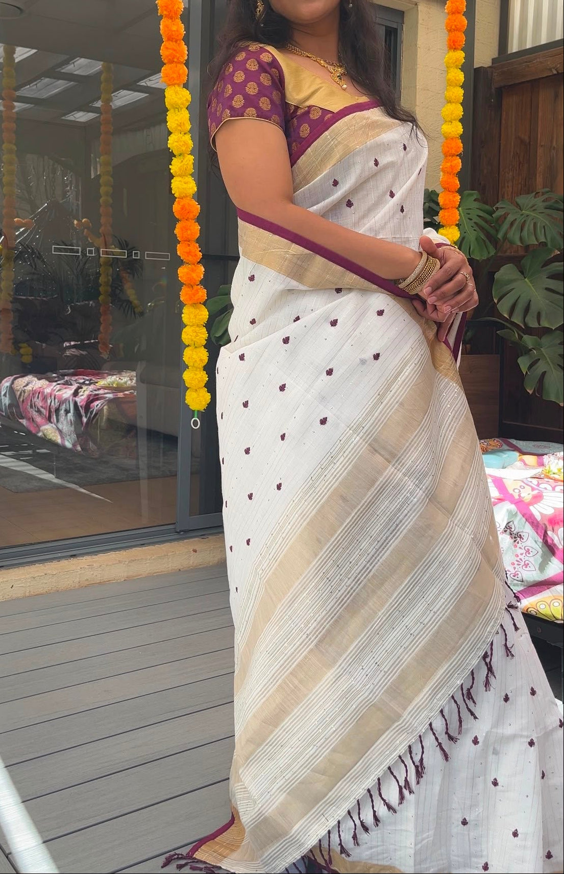 White and wine linen saree with thread embroidery and gold zari border